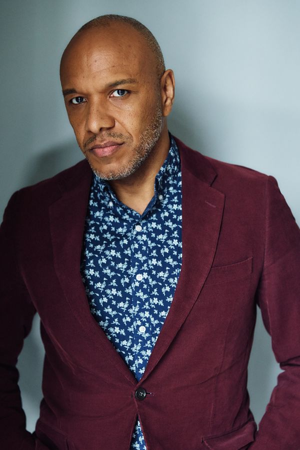 Alfred C. Kemp headshot, burgundy blazer, serious
