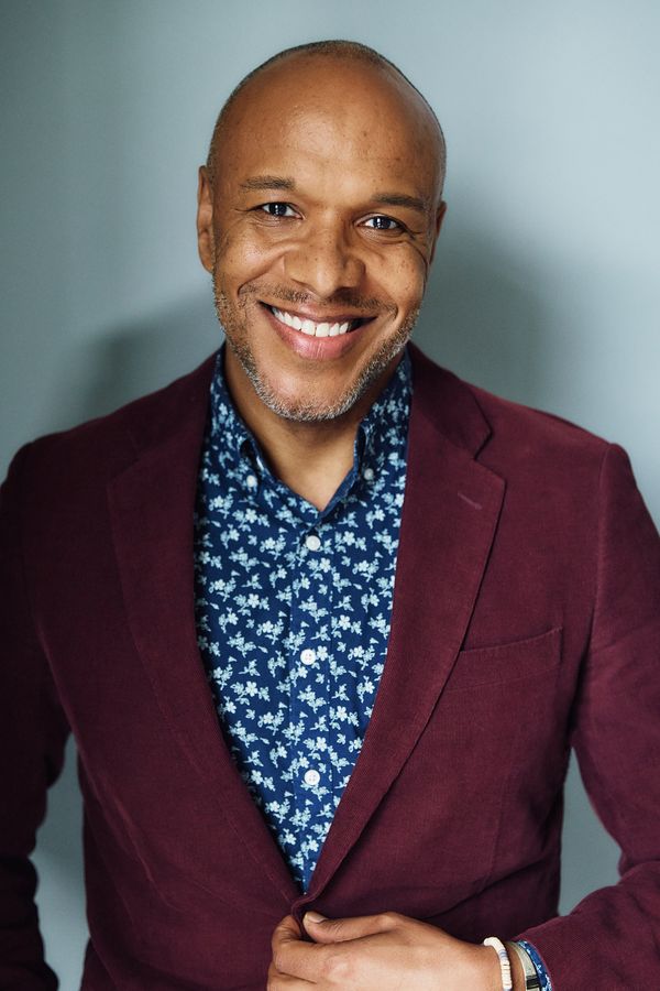Alfred C. Kemp headshot, burgundy blazer, smiling